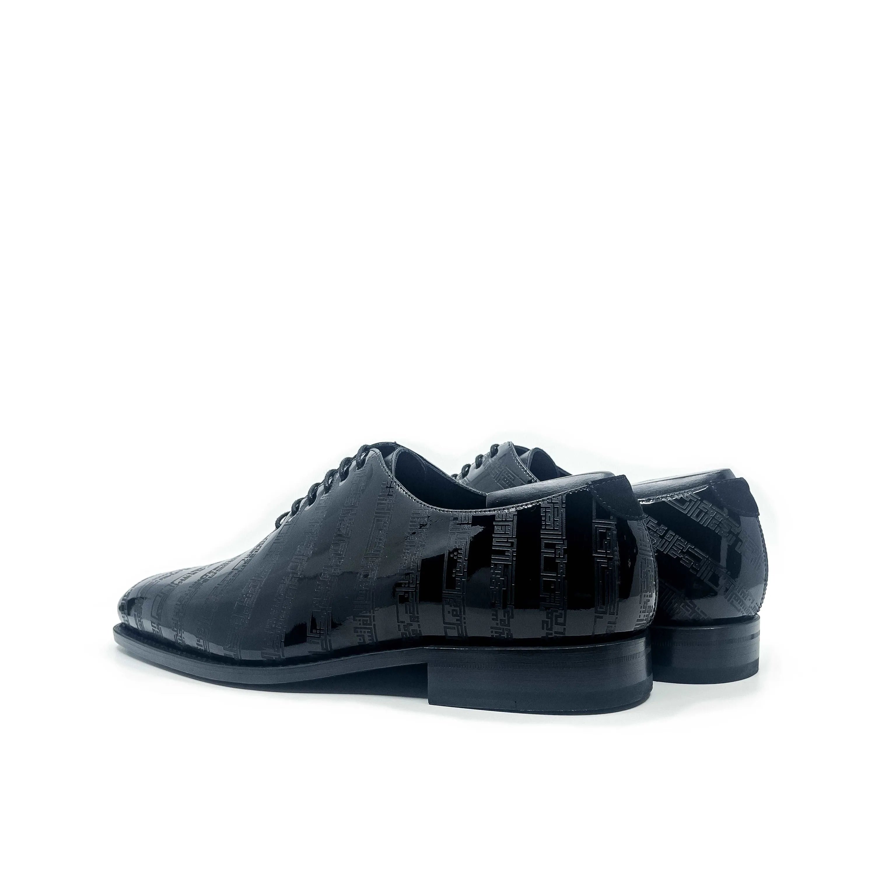 Shiny black Before The Throne wholecut shoes pair