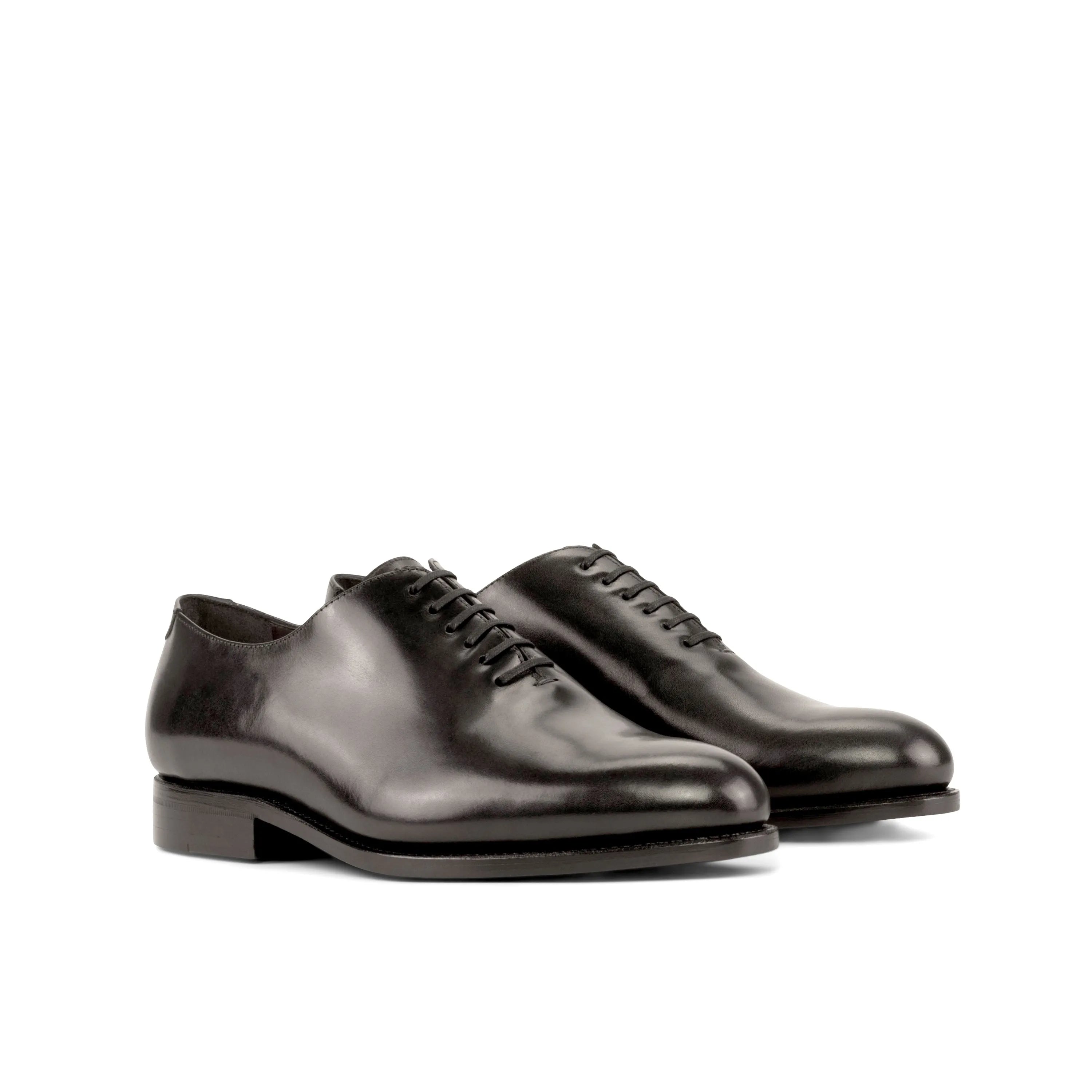 Pair of black leather Hans Wholecut shoes
