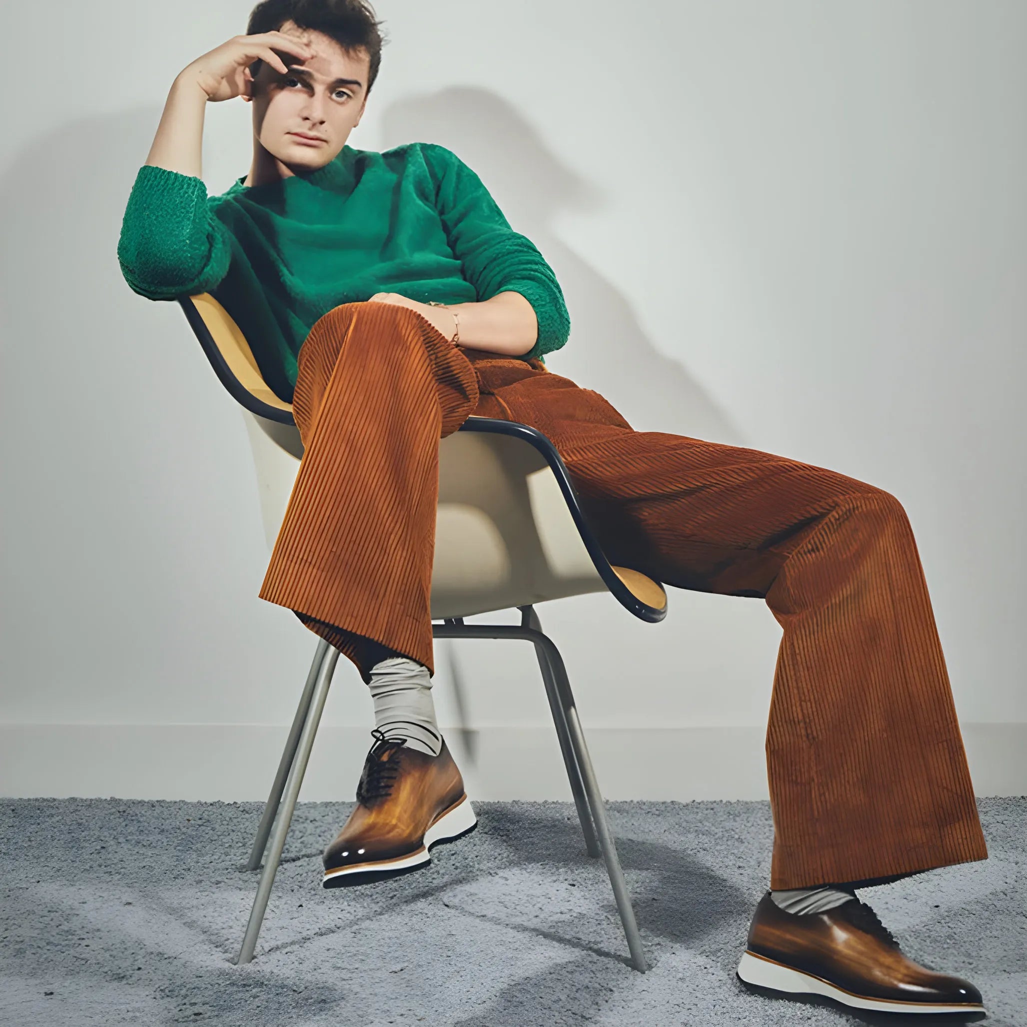 Man in green sweater wearing Lloyd wholecut patina shoes
