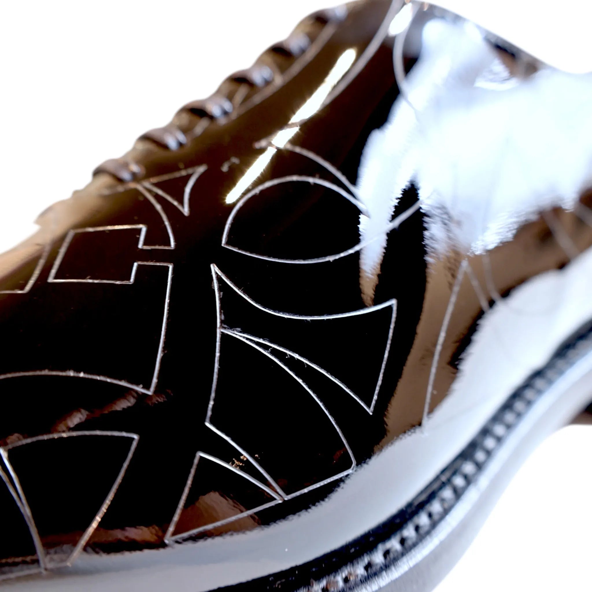 Shiny Quswa Noir Wholecut shoe with geometric design, premium Italian black