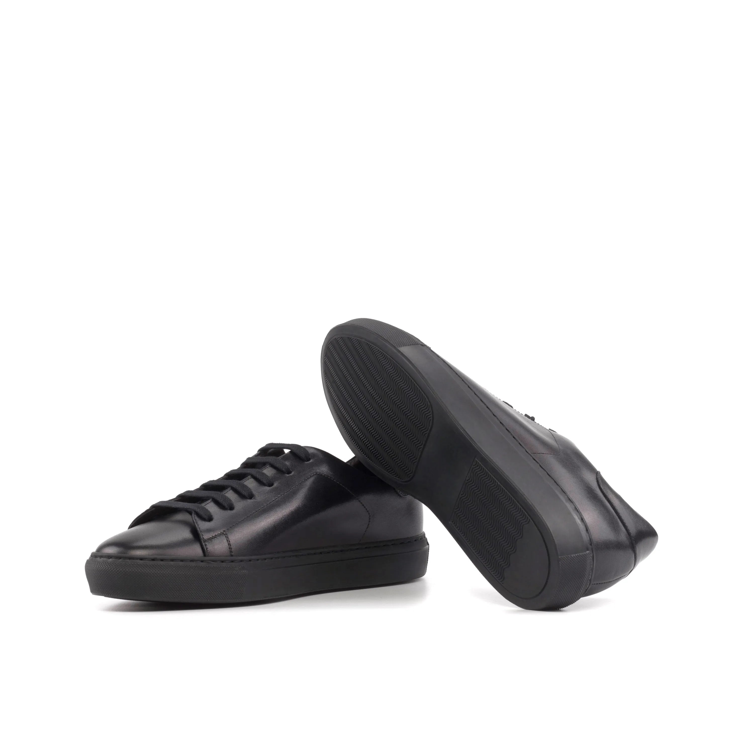 Pair of black leather Tycoon Trainer Sneaker cupsole trainers