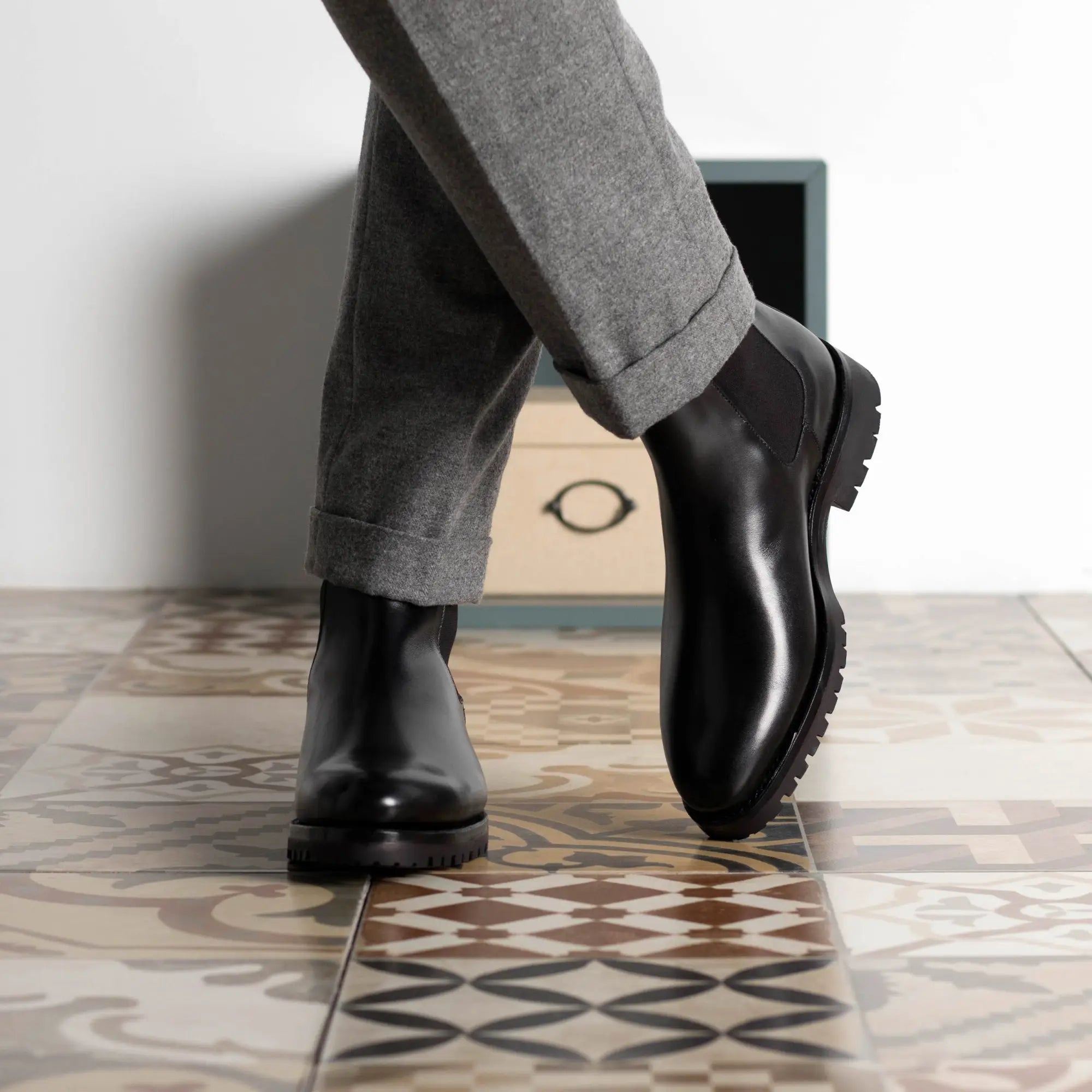 Black leather Chelsea boots.