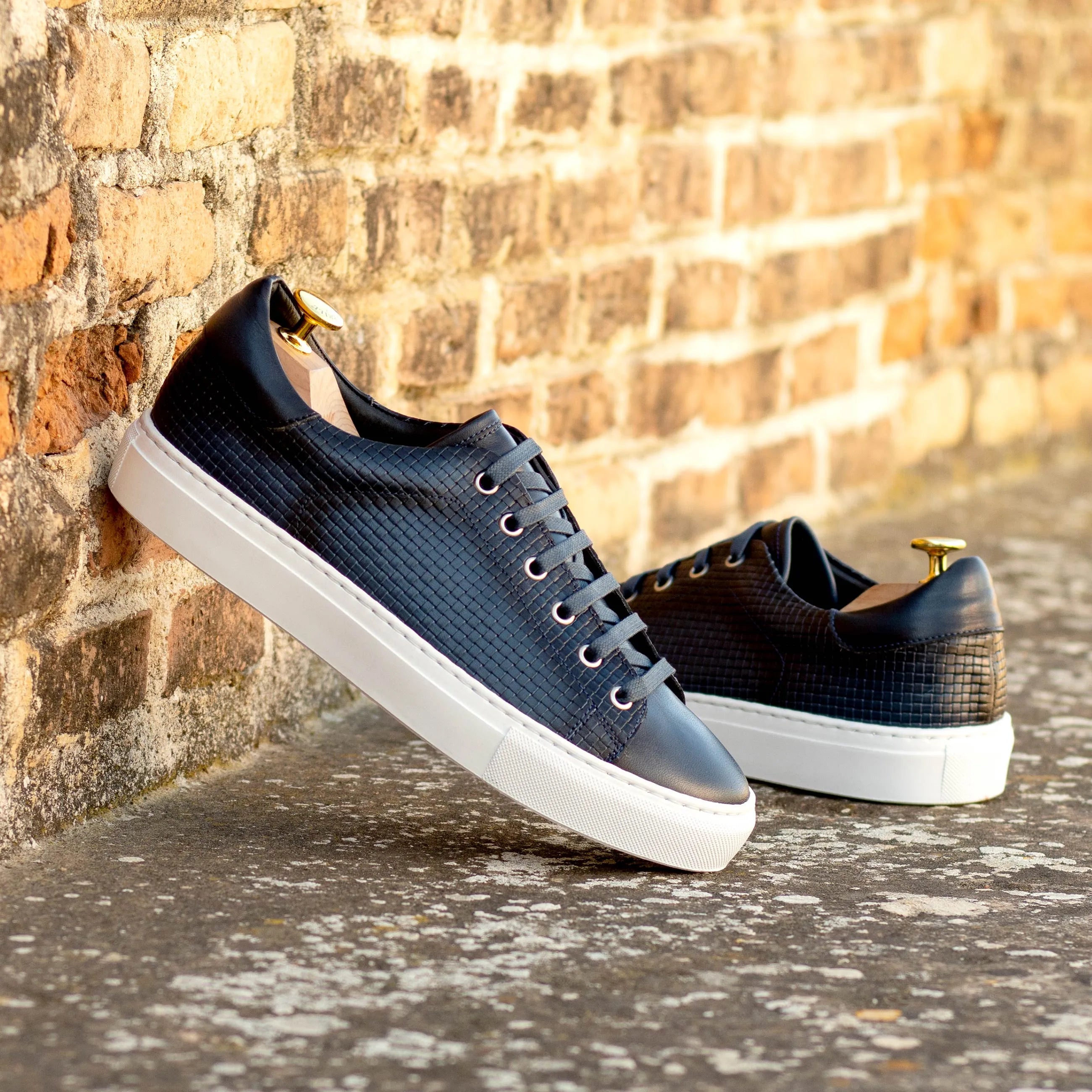 Pair of navy leather CapaFour trainer sneakers
