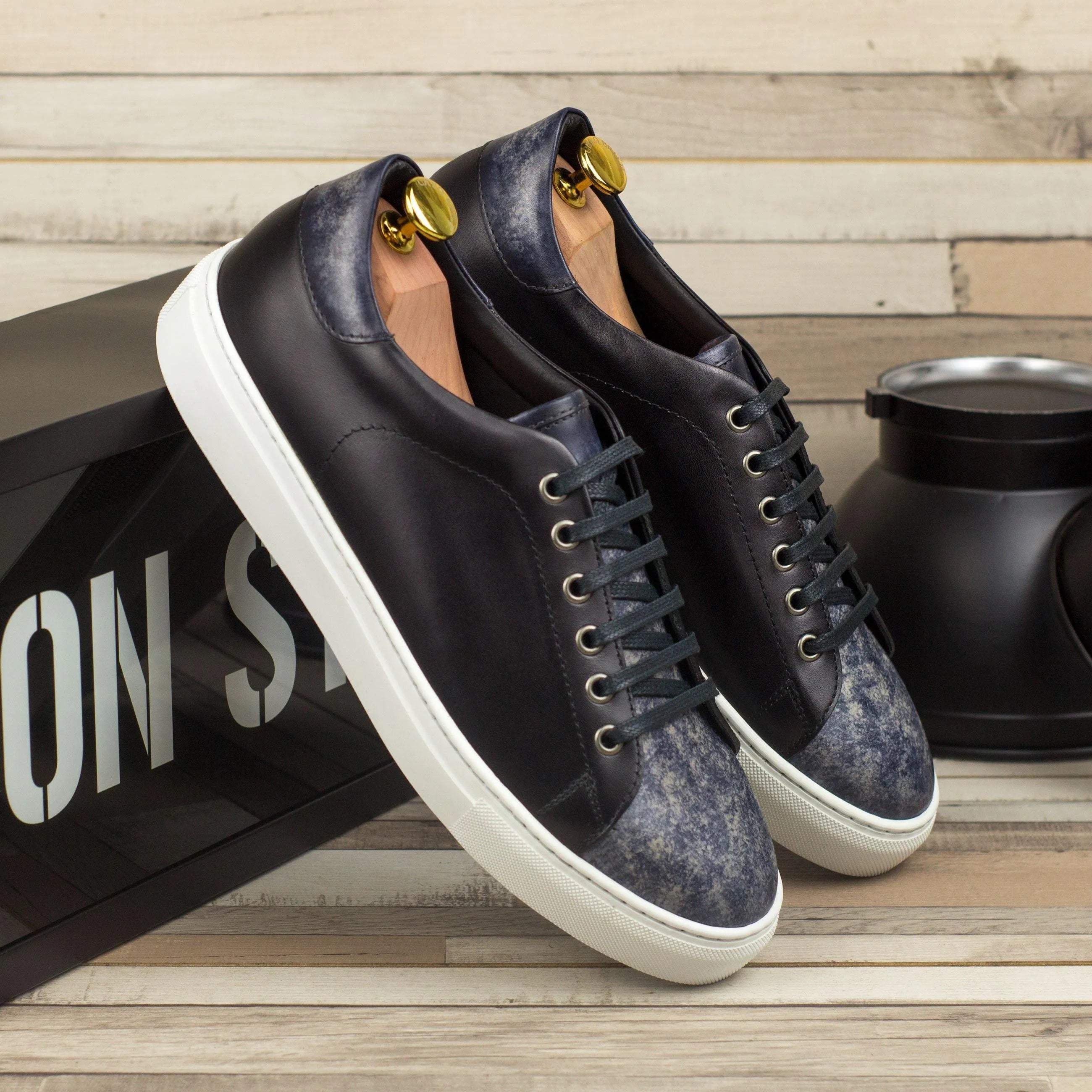 Pair of black leather DTT3 trainer patina cupsole sneakers II