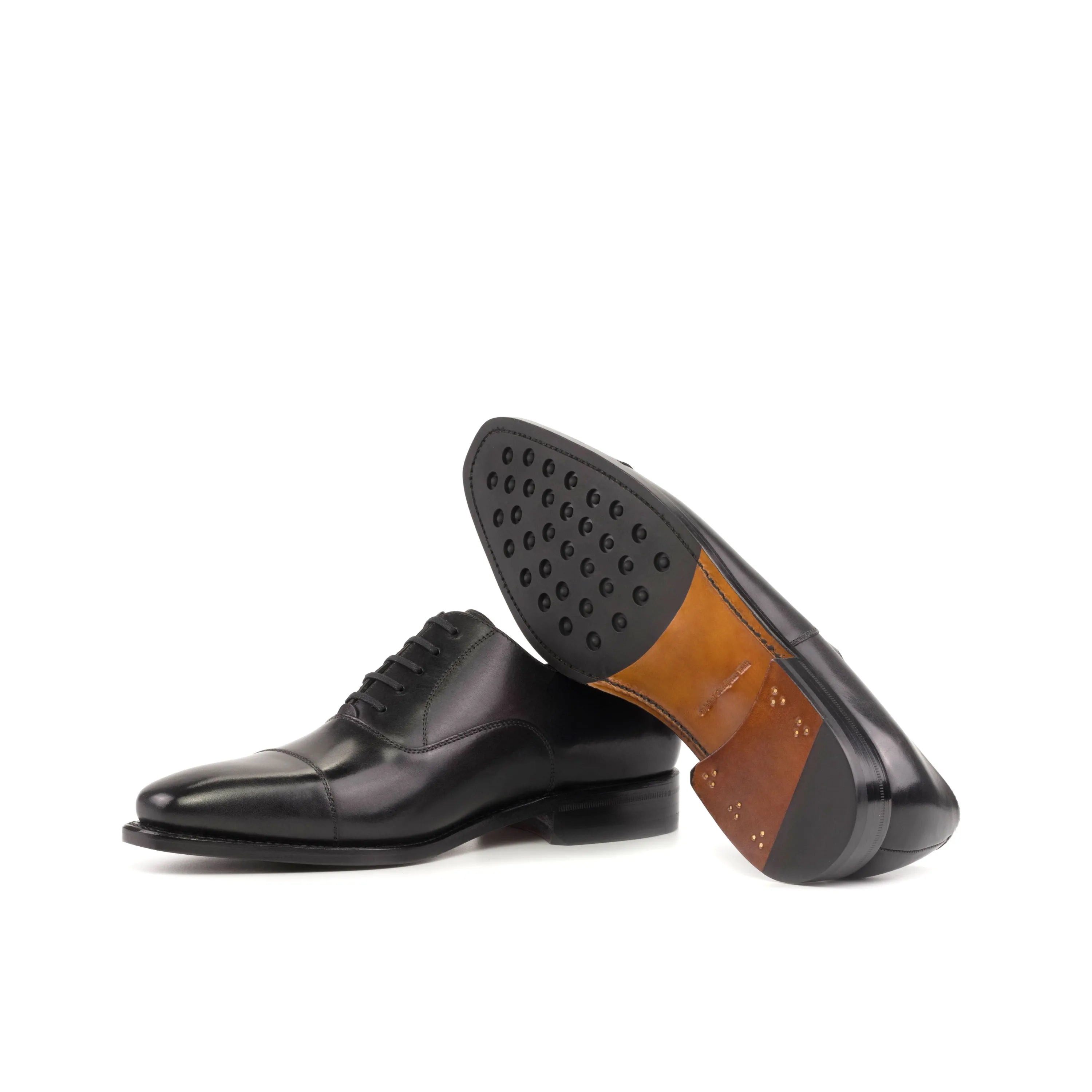 Pair of black leather Farell Oxford shoes in fast lane style