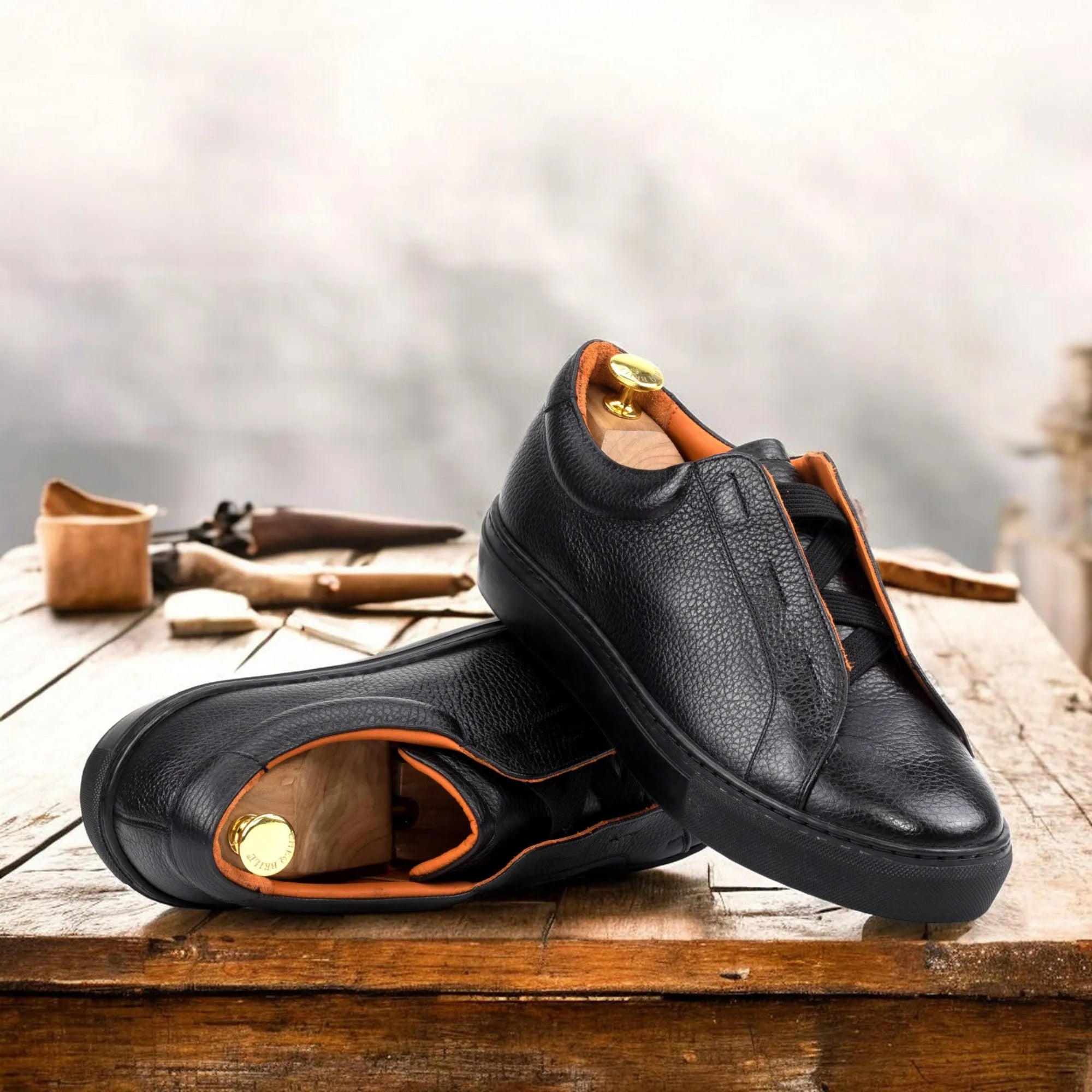 Pair of black leather Ordogan laceless sneaker II slip-ons