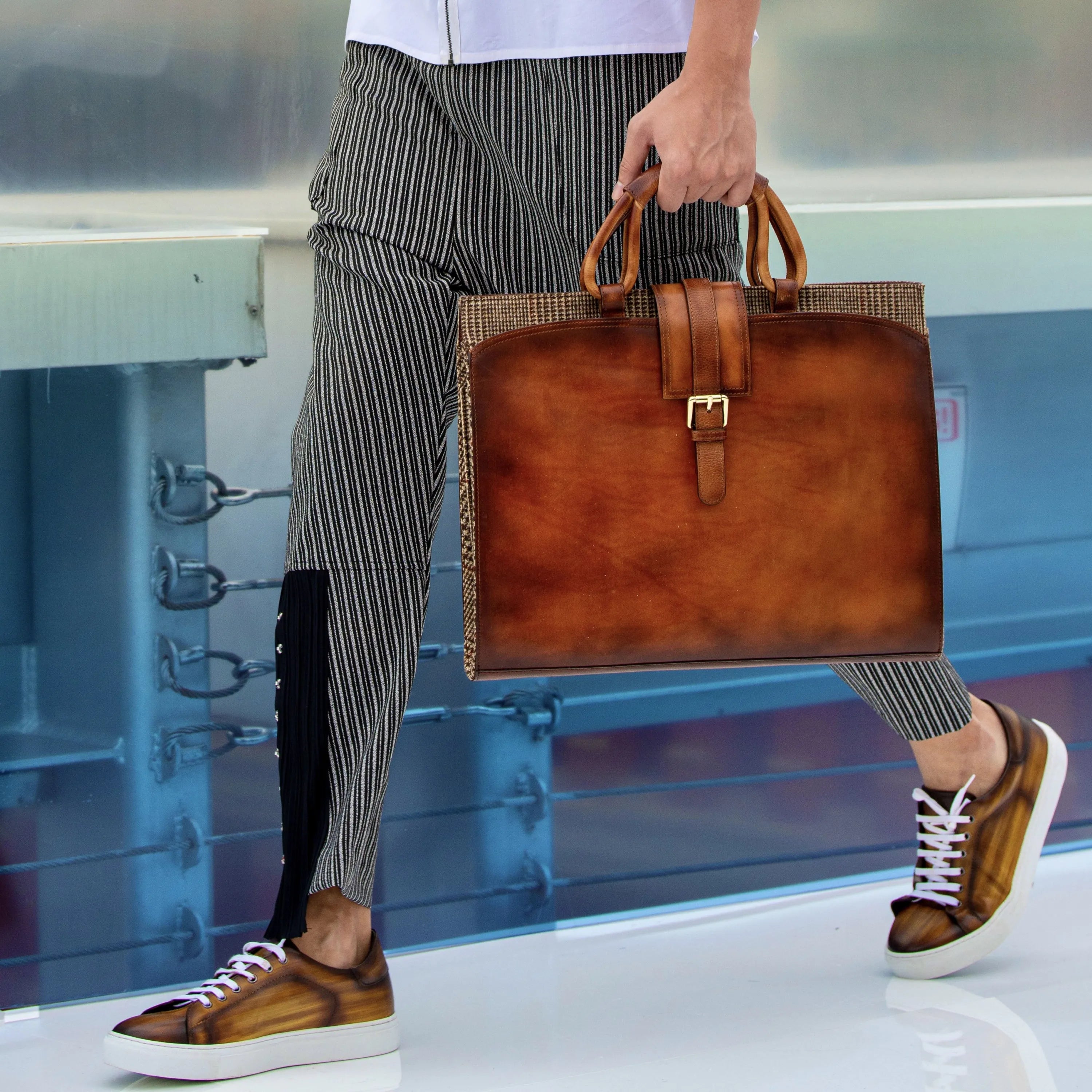 Brown leather briefcase buckle on Passby trainer patina sneaker